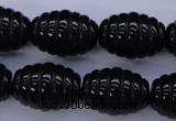 CAG1693 15.5 inches 15*20mm carved rice black agate beads