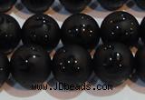 CAG6003 15.5 inches 10mm carved round matte black agate beads