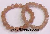 CGB4587 7.5 inches 8mm - 9mm round sunstone beaded bracelets