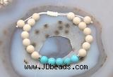 CGB6604 8mm round white fossil jasper & blue howlite adjustable bracelets